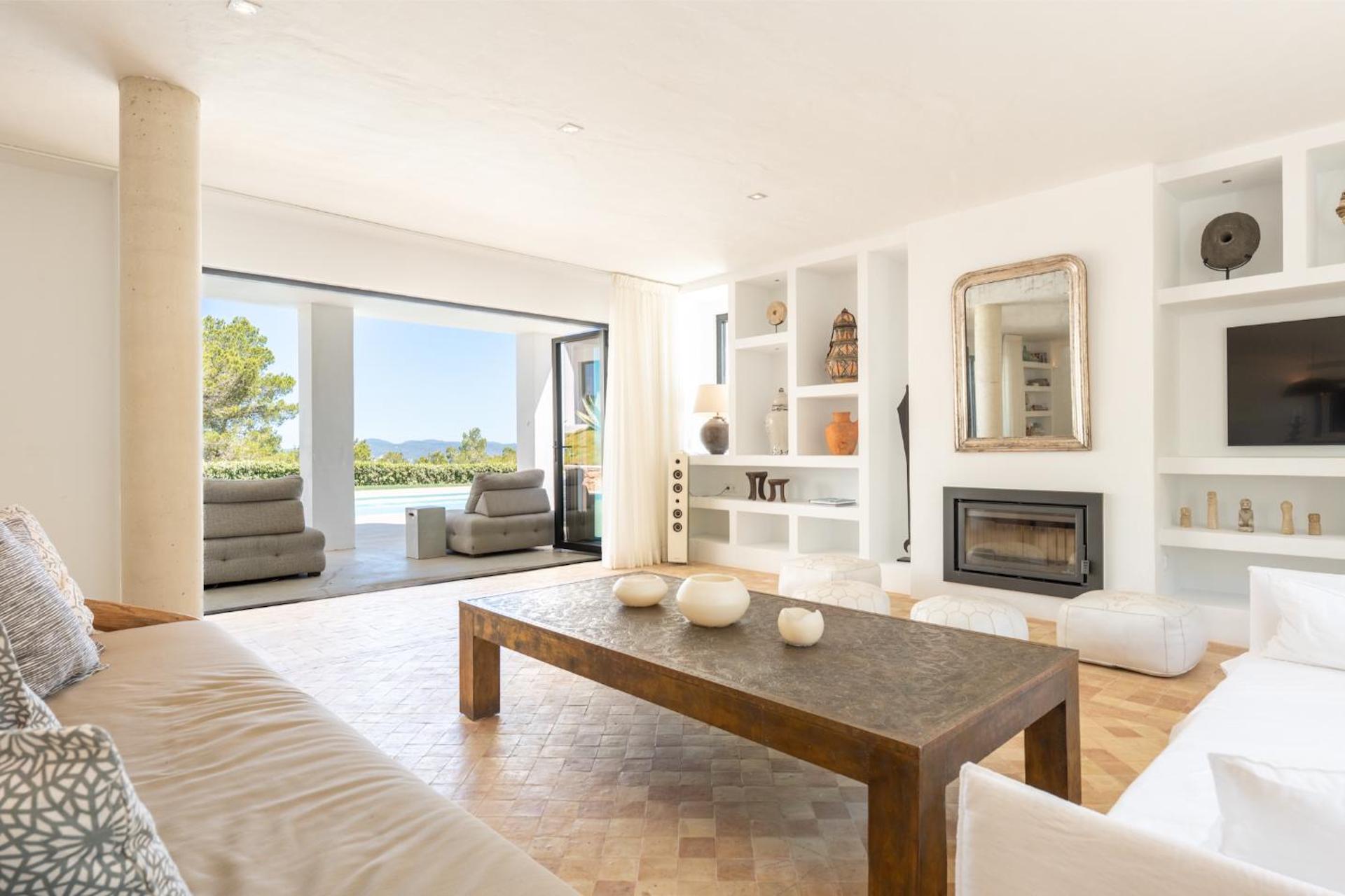 Resa Estates Ibiza modern finca villa for sale livingroom fire place.jpg